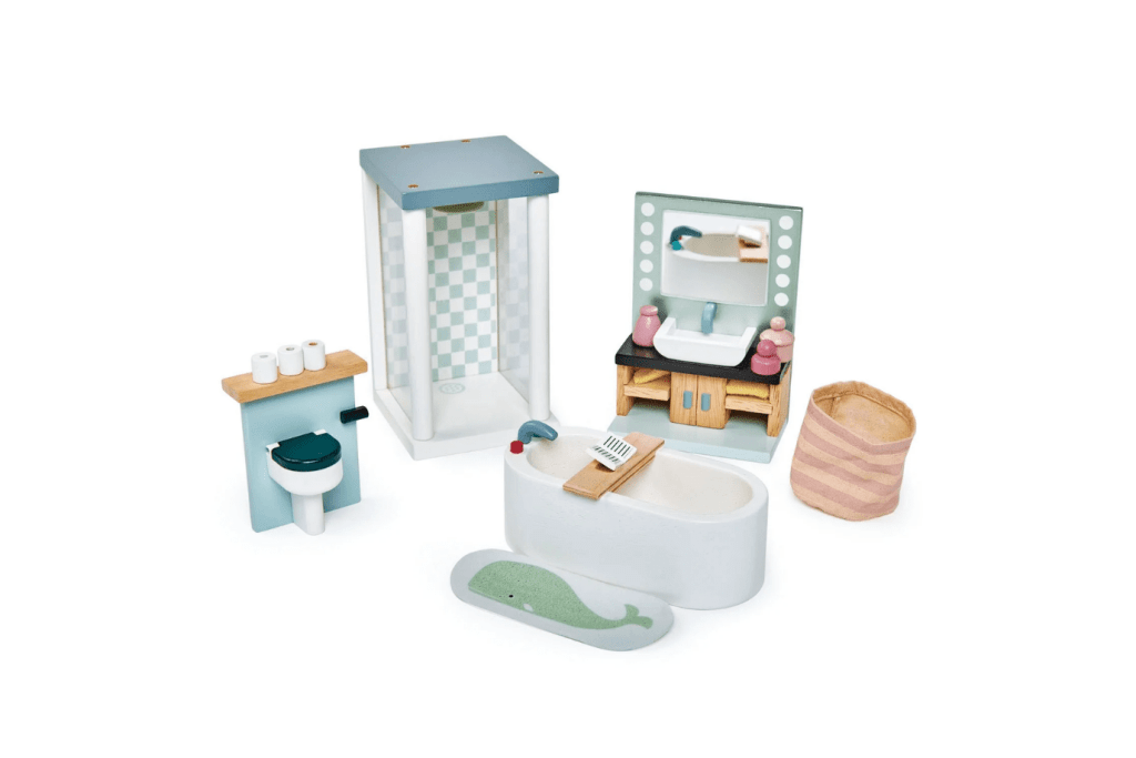 Dovetail Bathroom Set by Tender Leaf Toys, Includes 16 pieces - a sink unit, bathtub, bath tray with book, shower unit, toilet, bath mat illustrated with a whale, laundry bag and other bathroom accessories, 3 years and up, doll house accessories, best wooden doll house accessories, imaginary play toys, The Montessori Room, Toronto, Ontario, Canada. 