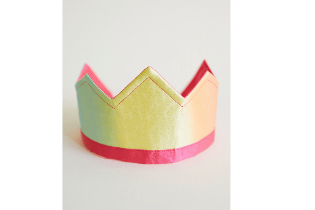 Sarah's Silks Rainbow Crown, imaginative play, dramatic play, costume, birthday celebrations, pretend play, 21 inches in circumference, elastic back, fits most children ages 3 to 9, jacquard silk, hand-painted, silkscreened, reversible, The Montessori Room, Toronto, Ontario, Canada.