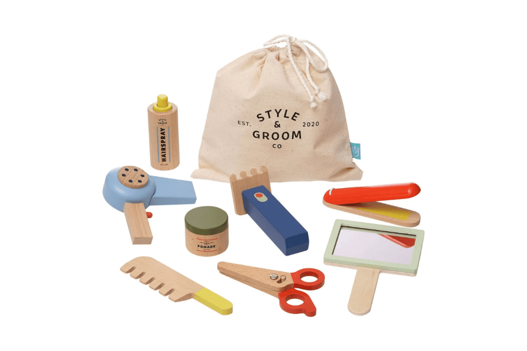 Style & Groom Wooden Hair Styling Set by Manhattan Toy, 9 piece wooden set for pretend play, hair dryer, straightener, comb, hair clipper, baby-safe mirror, pair of scissors - that actually open and close, pomade jar with removable lid, hairspray bottle with press-down nozzle and rattle sound, fabric drawstring bag for storage, imaginative play, 3 years and up, The Montessori Room, Toronto, Ontario, Canada.