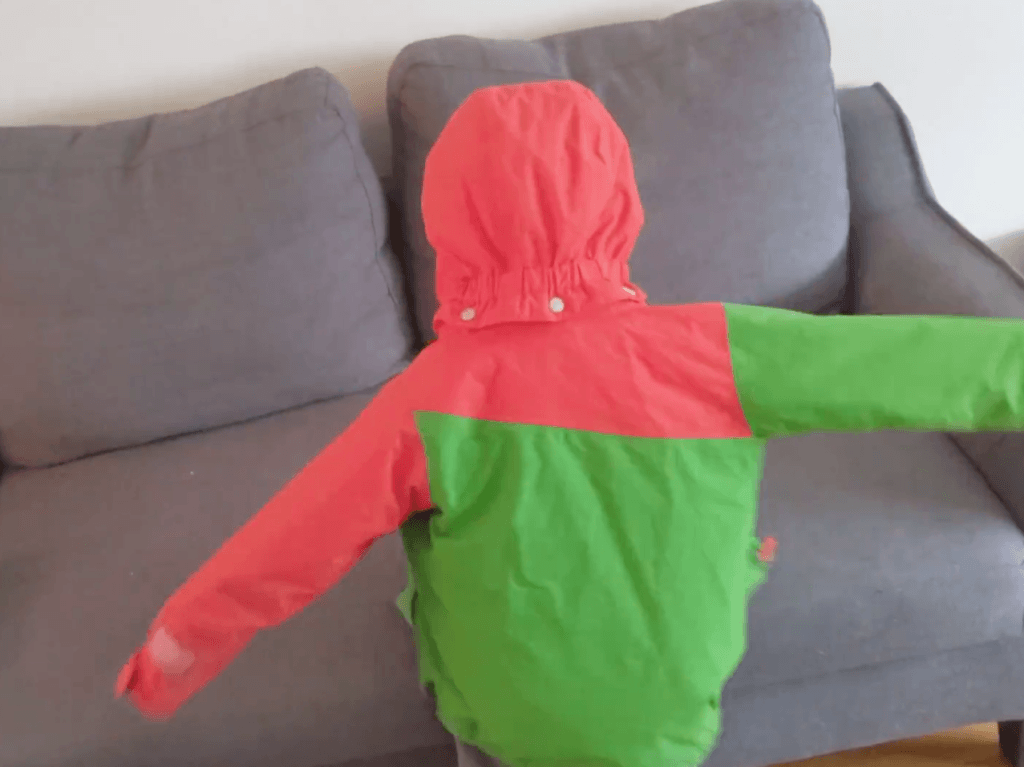 The Montessori Jacket Flip - Teach Your Toddler How To Put On Their Own Jacket | The Montessori Room