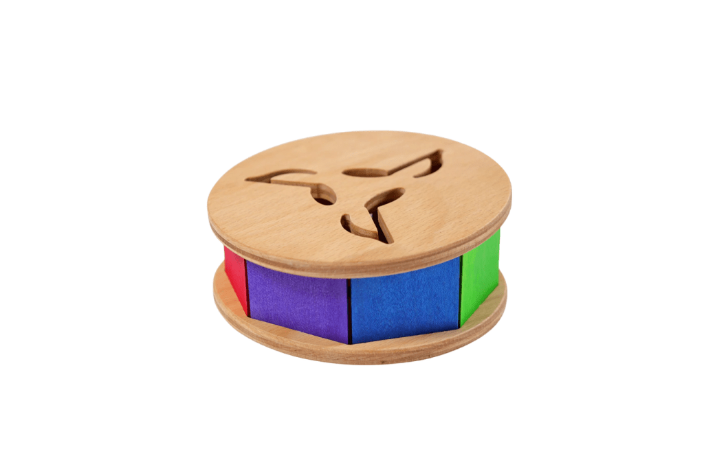 Grimm's Musical Rolling Wheel With 8 Coloured Tone Lamellas, wooden toys for infants, gross motor toys for infants, toys that encourage crawling, The Montessori Room, Toronto, Ontario, Canada. 