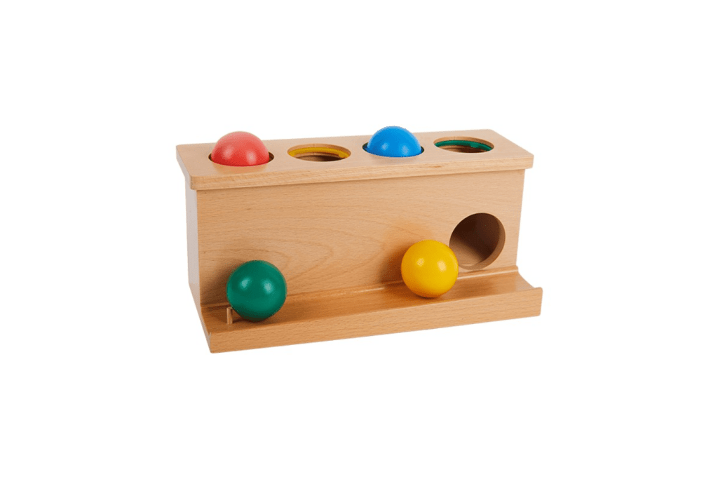 Montessori Push Box, Box with Balls to Push, Montessori Infant Materials, Montessori developmental aids, Montessori Nido materials, Montessori imbucare boxes, Montessori classroom materials, Montessori classroom packages, The Montessori Room, Toronto, Ontario, Canada. 