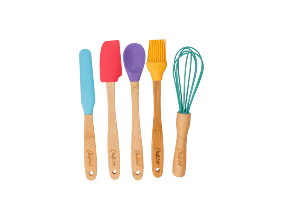 The ChefClub Kids Cooking Utensils, 4 - 10 years, a whisk, an icing spatula, a baking spatula, a cooking brush and a mixing spoon, practical life skills, child-sized practical life tools, The Montessori Room, Toronto, Ontario, Canada. 