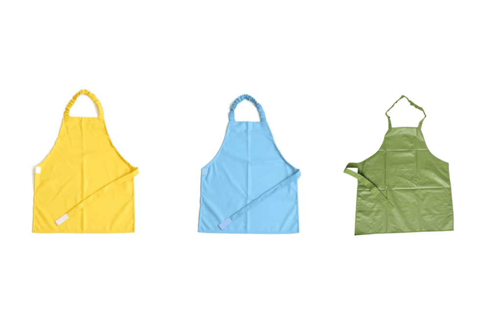 Waterproof Apron, aprons for plant care, aprons for practical life, aprons for art, aprons for Casa classroom, colour-coded aprons, Montessori classroom packages, The Montessori Room, Toronto, Ontario, Canada. 