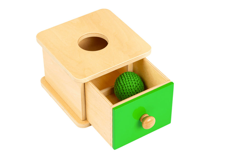 Box with Knitted Ball, The Montessori Room, Toronto, Ontario, Canada, Montessori materials, Montessori toys, Montessori shelf work, pincer grasp, palmer grasp, hand eye coordination, teaches object permanence, educational toys, early development toys, fine motor toys