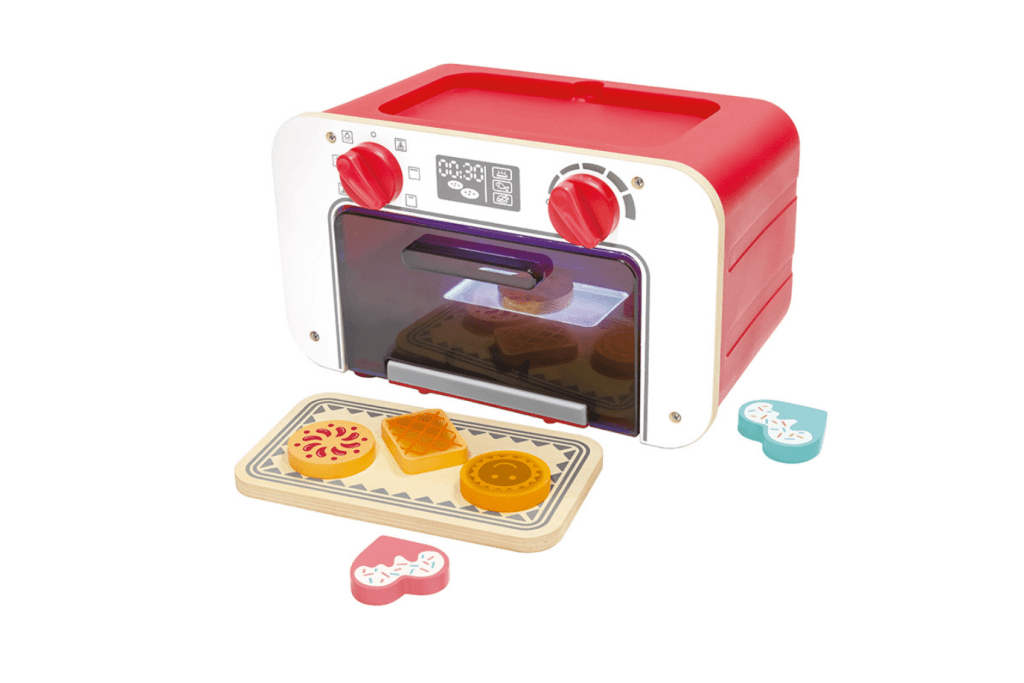Hape Baking Oven with Cookies, pretend play baking set for children 3 and up, 6 magic cookies included that change colours, timer dings, light in oven, imagination, language skills, dramatic play, language skills, best gifts for children who love to play pretend, The Montessori Room, Toronto, Ontario, Canada. 